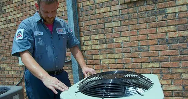 R.J. Kielty technician performing air conditioning maintenance